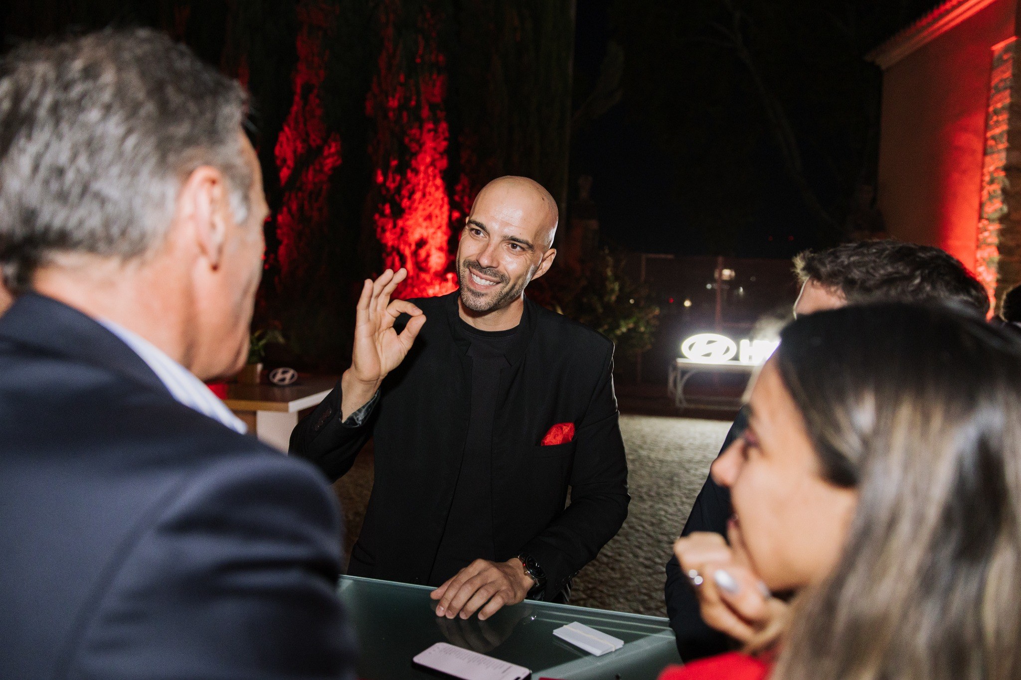 Aléxis Ricardo performing close-up magic at the Hyundai IONIQ 3 launch event
